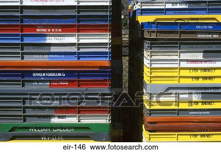 Stock Photograph - Close Up of Stack of Coloured Fish Crates Ireland. Fotosearch