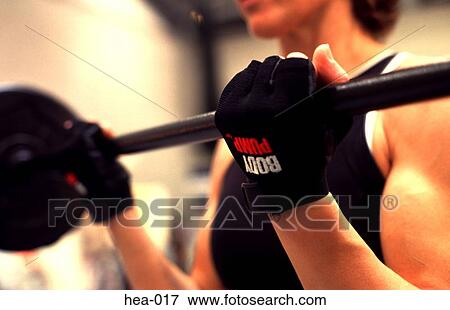 Close Up of Womans Gloved Hand Lifting Weights View Large Photo Image Stock Photo - Close Up of Womans Gloved Hand Lifting Weights. Fotosearch