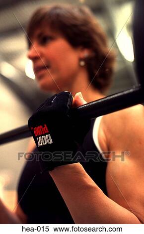 Close Up of Womans Gloved Hand Lifting Weights View Large Photo Image Stock Photography - Close Up of Womans Gloved Hand Lifting Weights. Fotosearch