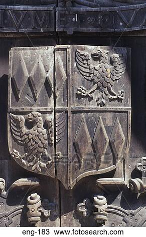 Stock Image - Coat of Arms Carved into Door Bath. Fotosearch