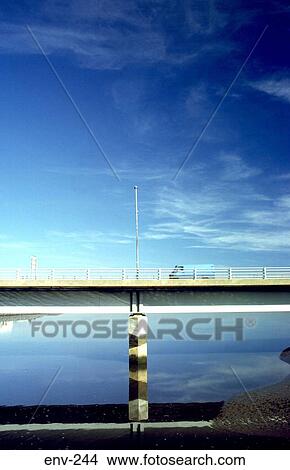 Concrete Road Bridge against Water and Blue Sky View Large Photo Image Picture - Concrete Road Bridge against Water and Blue Sky. Fotosearch