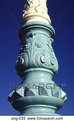 Stock Image - Detail of Ornate Cast Iron Lamppost Base England UK. Fotosearch