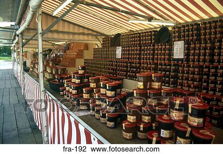 Stock Image - Display of Jars of Apple and Quince Preserve France. Fotosearch