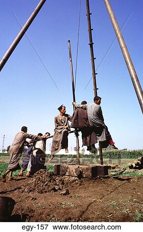 Farmers Drilling Water Bore Hole Egypt View Large Photo Image Stock Photo - Farmers Drilling Water Bore Hole Egypt. Fotosearch
