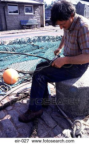 Fisherman Mending Nets View Large Photo Image Stock Photo - Fisherman Mending Nets. Fotosearch