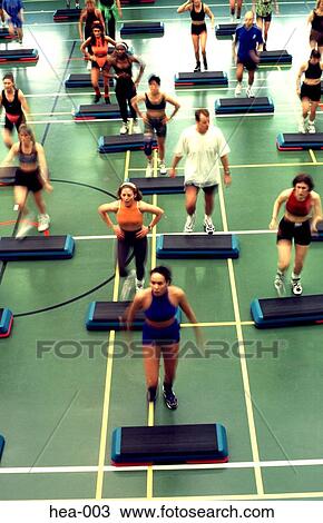 Stock Image - Front View of Step Aerobics Class. Fotosearch