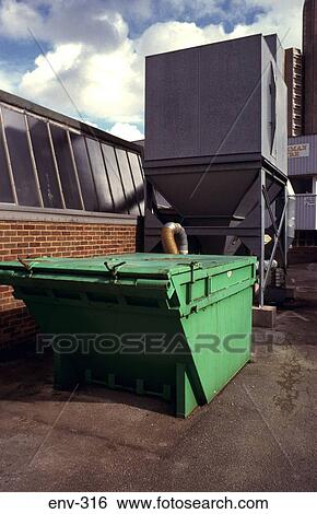 Stock Photograph - Green Wood Chip Storage Skip. Fotosearch