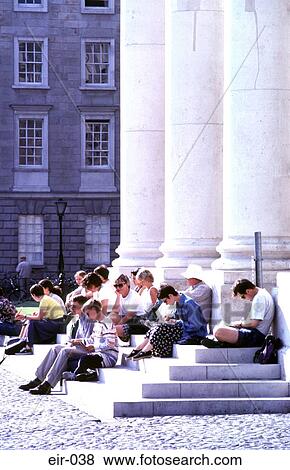 Stock Photo - Group of People Taking Notes on Steps by Columns. Fotosearch