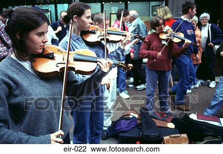 Stock Image - Group of Young Musicians Playing Violins Dublin. Fotosearch
