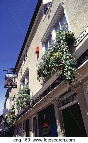 Stock Image - Hanging Basket of Flowers on Wall Windsor England. Fotosearch