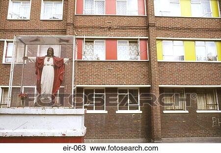 Stock Image - Jesus Statue Outside Block of Flats. Fotosearch
