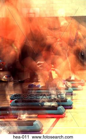 Stock Image - Long Exposure Photo of Side of Step Aerobics Class. Fotosearch