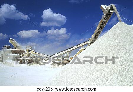Stock Photography - Machines Piling of Limestone Chips Egypt. Fotosearch