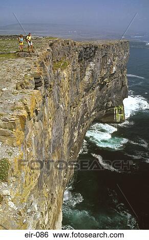 Man and Women on Cliff Top Inishmore View Large Photo Image Stock Photograph - Man and Women on Cliff Top Inishmore. Fotosearch
