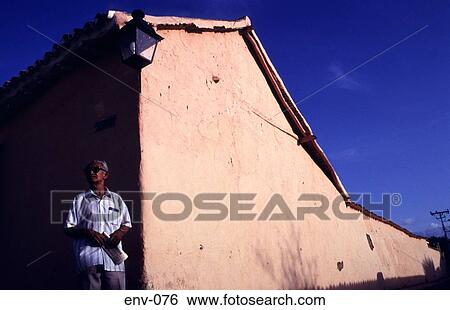 Stock Photograph - Man at Corner of Old Plastered Building. Fotosearch