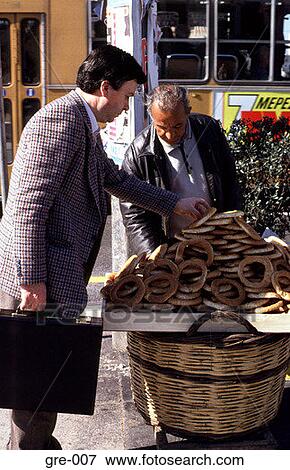Man Buying Bread Rolls from a Market Stall Athens View Large Photo Image Stock Photo - Man Buying Bread Rolls from a Market Stall Athens. Fotosearch