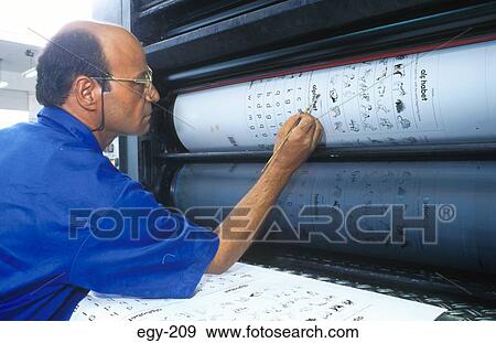 Man Examining Printed Roll of Paper Egypt View Large Photo Image Stock Photo - Man Examining Printed Roll of Paper Egypt. Fotosearch