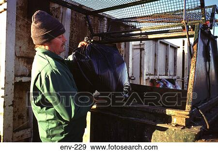 Man Putting Rubbish Sack in Skip View Large Photo Image Stock Photo - Man Putting Rubbish Sack in Skip. Fotosearch