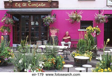 Man Sitting outside Pub Kinvarra Ireland View Large Photo Image Stock Photo - Man Sitting outside Pub Kinvarra Ireland. Fotosearch