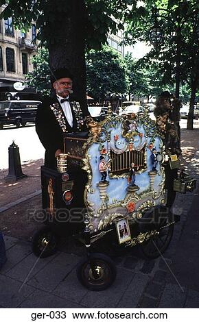 Stock Image - Organ Grinder Dusseldorf Germany. Fotosearch