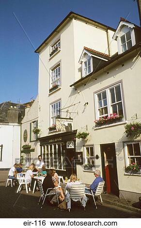 Stock Photograph - People Sitting Outside Pub Kinsale Ireland. Fotosearch
