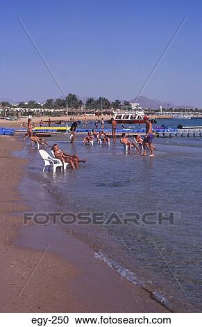 People Sunbathing on Shore Sharm el-Sheik Egypt View Large Photo Image Stock Image - People Sunbathing on Shore Sharm el-Sheik Egypt. Fotosearch