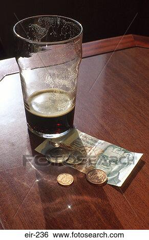 Pint of Guinness and Change on a Bar Ireland View Large Photo Image Stock Photograph - Pint of Guinness and Change on a Bar Ireland. Fotosearch