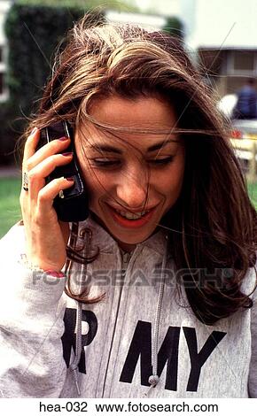Portrait of Young Woman using Mobile Telephone View Large Photo Image Stock Image - Portrait of Young Woman using Mobile Telephone. Fotosearch