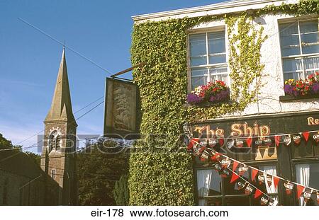 Stock Photo - Pub and Church in Irish Village. Fotosearch