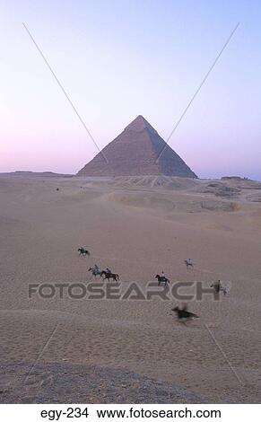 Picture - Riders in Desert by Great Pyramid Giza Egypt. Fotosearch