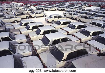 Stock Image - Rows of Identical Cars awaiting Export Egypt. Fotosearch
