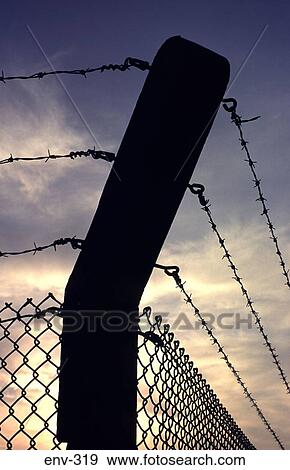 Silhouetted Corner Fence Post with Barbed Wire Top View Large Photo Image Stock Photo - Silhouetted Corner Fence Post with Barbed Wire Top. Fotosearch