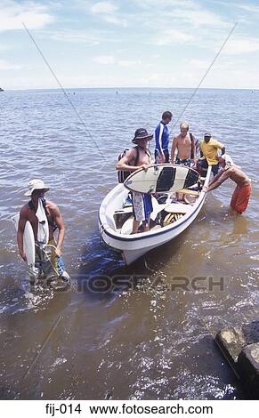 Surfers in a Boat Momi Bay Fiji View Large Photo Image Picture - Surfers in a Boat Momi Bay Fiji. Fotosearch