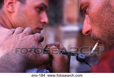Tattooist at Work Rome Italy View Large Photo Image Picture - Tattooist at Work Rome Italy. Fotosearch