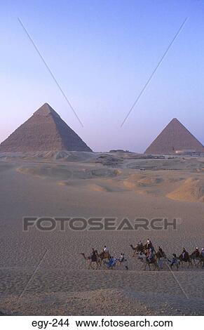 Tourists on Camels by Great Pyramid Giza Egypt View Large Photo Image Picture - Tourists on Camels by Great Pyramid Giza Egypt. Fotosearch
