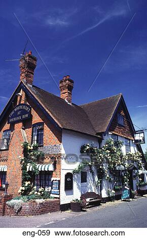 Traditional Pub with Hanging Flower Baskets UK View Large Photo Image Stock Photo - Traditional Pub with Hanging Flower Baskets UK. Fotosearch