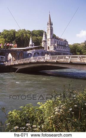 View across River Gave de Pau of the Basilica Lourdes France View Large Photo Image Stock Image - View across River Gave de Pau of the Basilica Lourdes France. Fotosearch