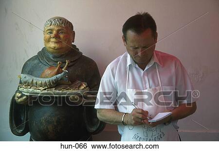 Waiter and Monk Figure Szentendre Hungary View Large Photo Image Stock Photograph - Waiter and Monk Figure Szentendre Hungary. Fotosearch