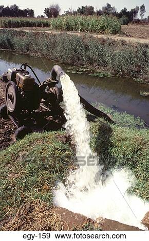 Water Pouring out of Irrigation Pipe Egypt View Large Photo Image Stock Photo - Water Pouring out of Irrigation Pipe Egypt. Fotosearch