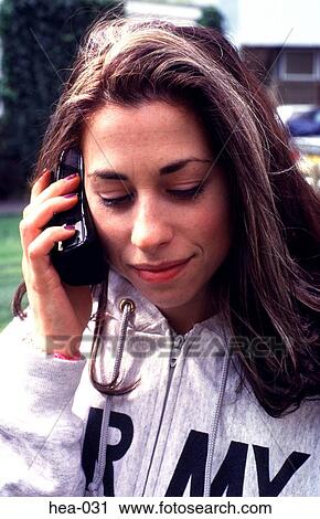 Woman in Tracksuit Using Mobile Telephone View Large Photo Image Stock Image - Woman in Tracksuit Using Mobile Telephone. Fotosearch