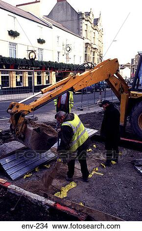 Workmen Digging Up Urban Road With JCB View Large Photo Image Picture - Workmen Digging Up Urban Road With JCB. Fotosearch