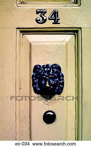 Picture - Yellow Georgian Door with Brass Lion. Fotosearch