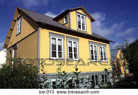 Stock Image - Yellow Wooden Clapboard House Reykjavik Iceland. Fotosearch