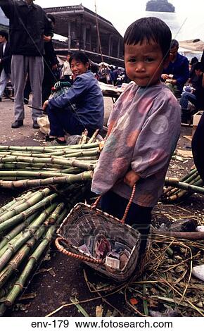 Young Chinese Boy holding a Basket of Money View Large Photo Image Stock Photo - Young Chinese Boy holding a Basket of Money. Fotosearch