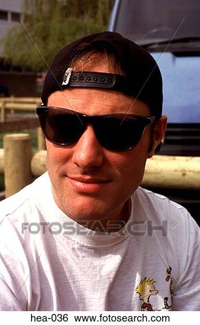 Young Man Wearing Sporty Clothes and Sunglasses View Large Photo Image Stock Photograph - Young Man Wearing Sporty Clothes and Sunglasses. Fotosearch