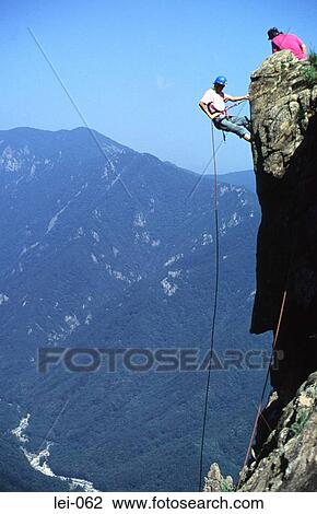 Abseiling on Mountainside View Large Photo Image Stock Image - Abseiling on Mountainside. Fotosearch