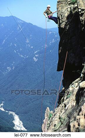 Abseiling on Mountainside View Large Photo Image Stock Photo - Abseiling on Mountainside. Fotosearch