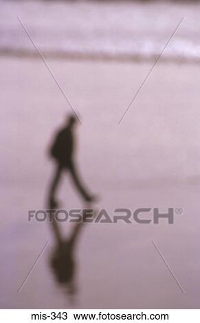Blurred View of Man Walking on Beach UK View Large Photo Image Stock Image - Blurred View of Man Walking on Beach UK. Fotosearch