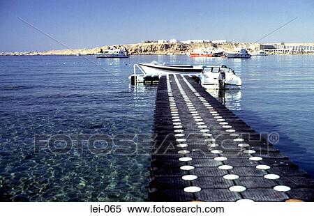Stock Photography - Boat at the End of Jetty Egypt. Fotosearch
