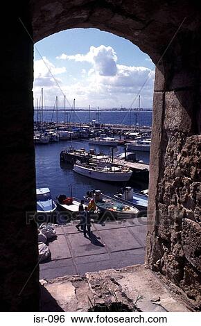 Boats in Akko Harbour framed by Archway Israel View Large Photo Image Stock Photograph - Boats in Akko Harbour framed by Archway Israel. Fotosearch